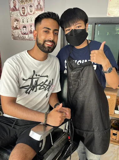 Customer thumbs up with the barber